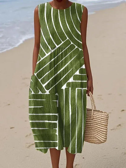 Vestido de mujer confeccionado en algodón y lino con estampado abstracto y bolsillos laterales.