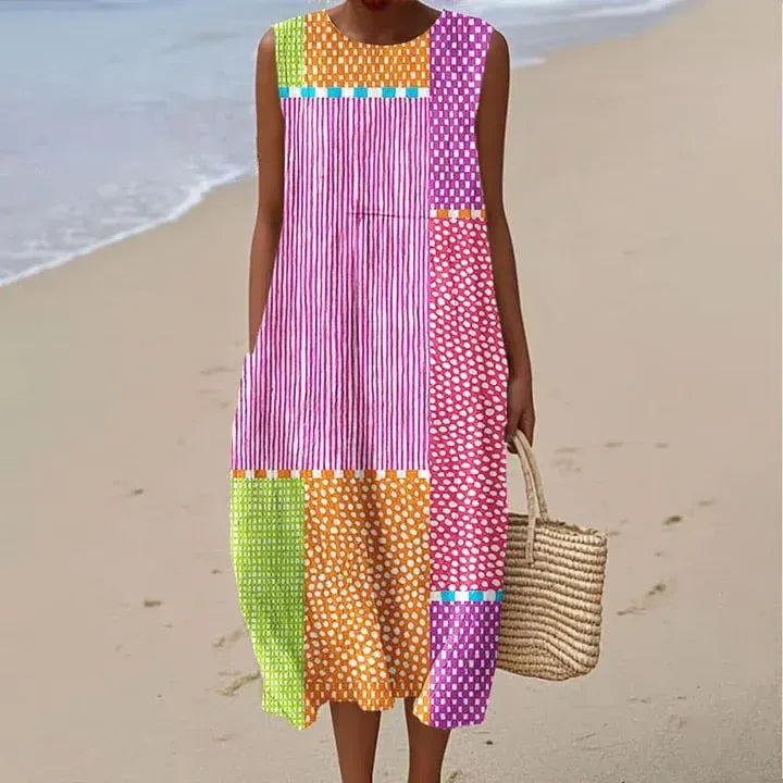 Vestido de mujer confeccionado en algodón y lino con estampado abstracto y bolsillos laterales.