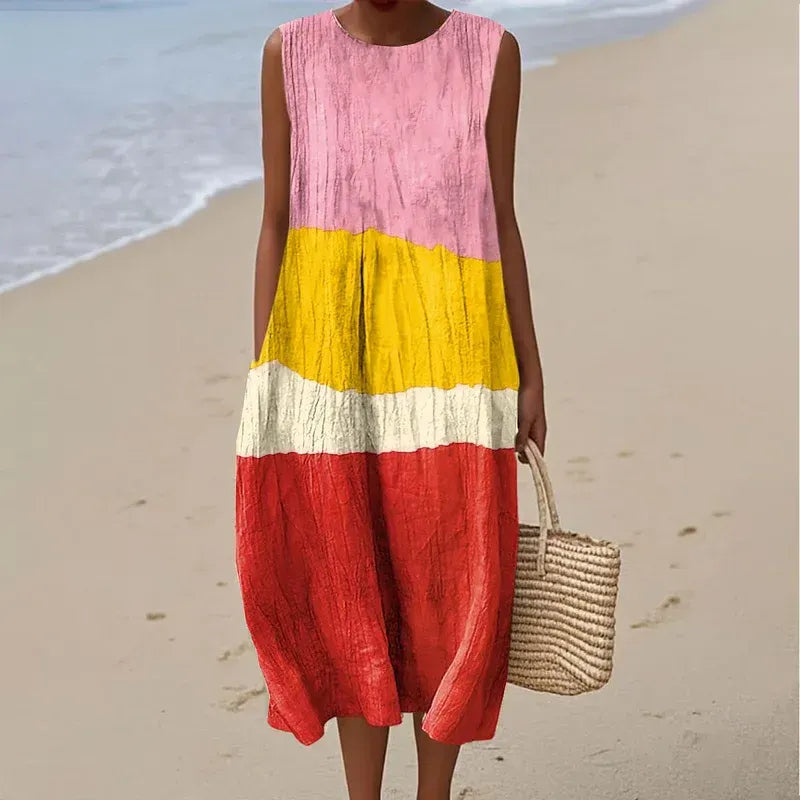 Vestido de mujer confeccionado en algodón y lino con estampado abstracto y bolsillos laterales.