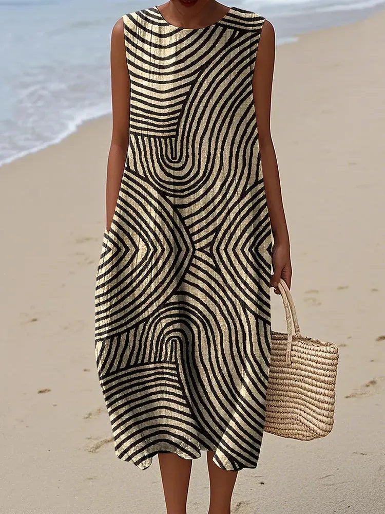 Vestido de mujer confeccionado en algodón y lino con estampado abstracto y bolsillos laterales.